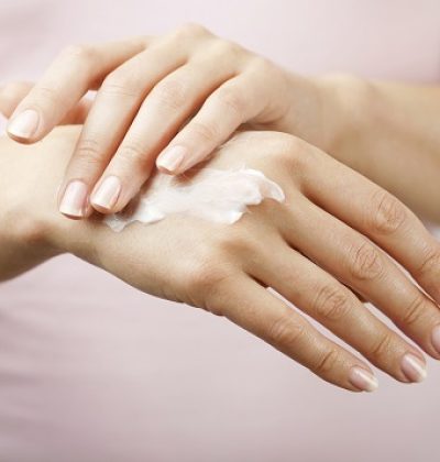 beautiful woman hands with cream